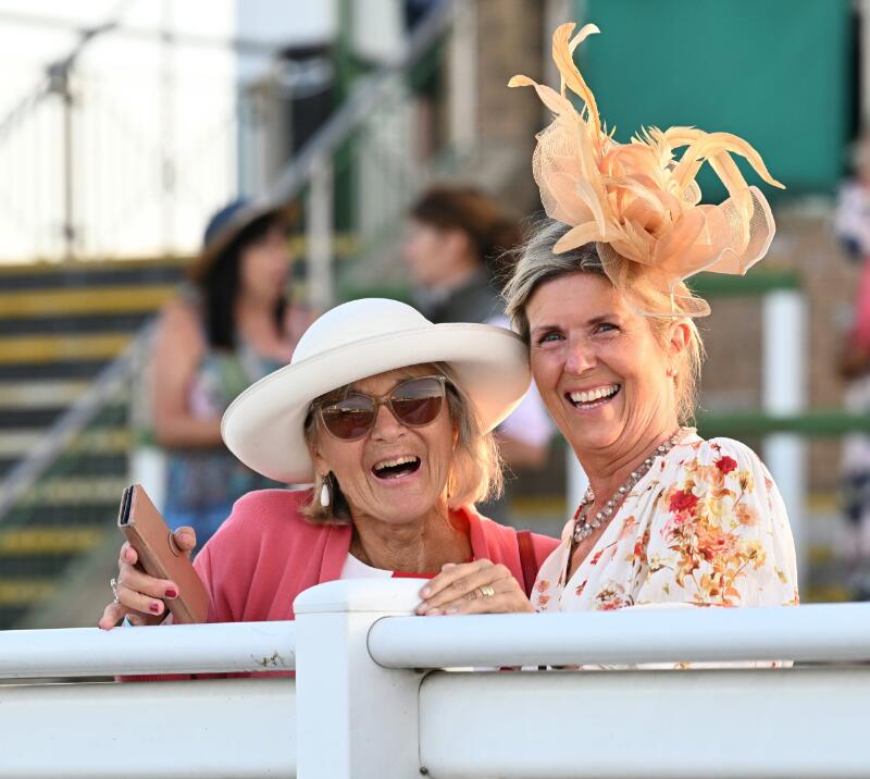 Two race goers smile happily at the trackside at Great Yarmouth