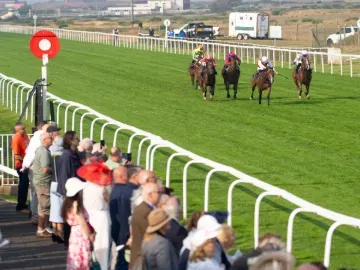 Horses race down the flat track at Great Yarmouth