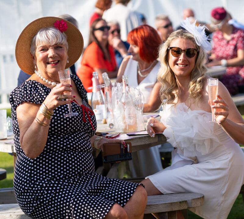 Two race goers raise their glasses of prosecco at Great Yarmouth Races