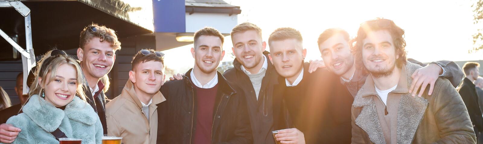 A large group of friends enjoy the races at Great Yarmouth