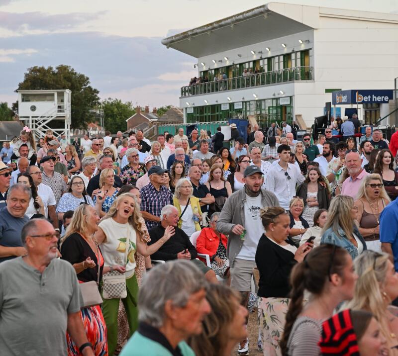 The crowds in front of the grandstands ready for entertainment at Great Yarmouth Races