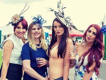 Group of ladies posing for a photo while at the races at Great Yarmouth Racecourse.