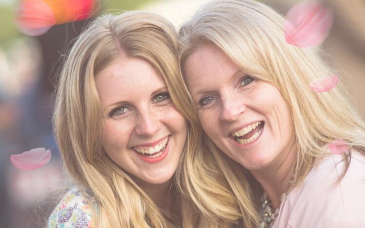 Mother and daughter enjoying a day at the races