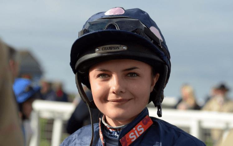 Jockey Megan Nicholls smiles for a photo