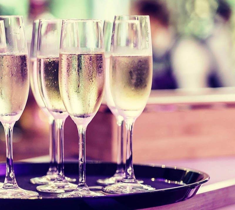 Glasses of champagne on a delivery tray