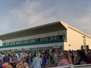The grandstand and the crowds at Great Yarmouth at dusk